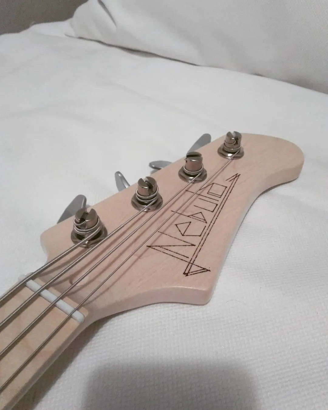 The headstock, with "Nebula" engraved