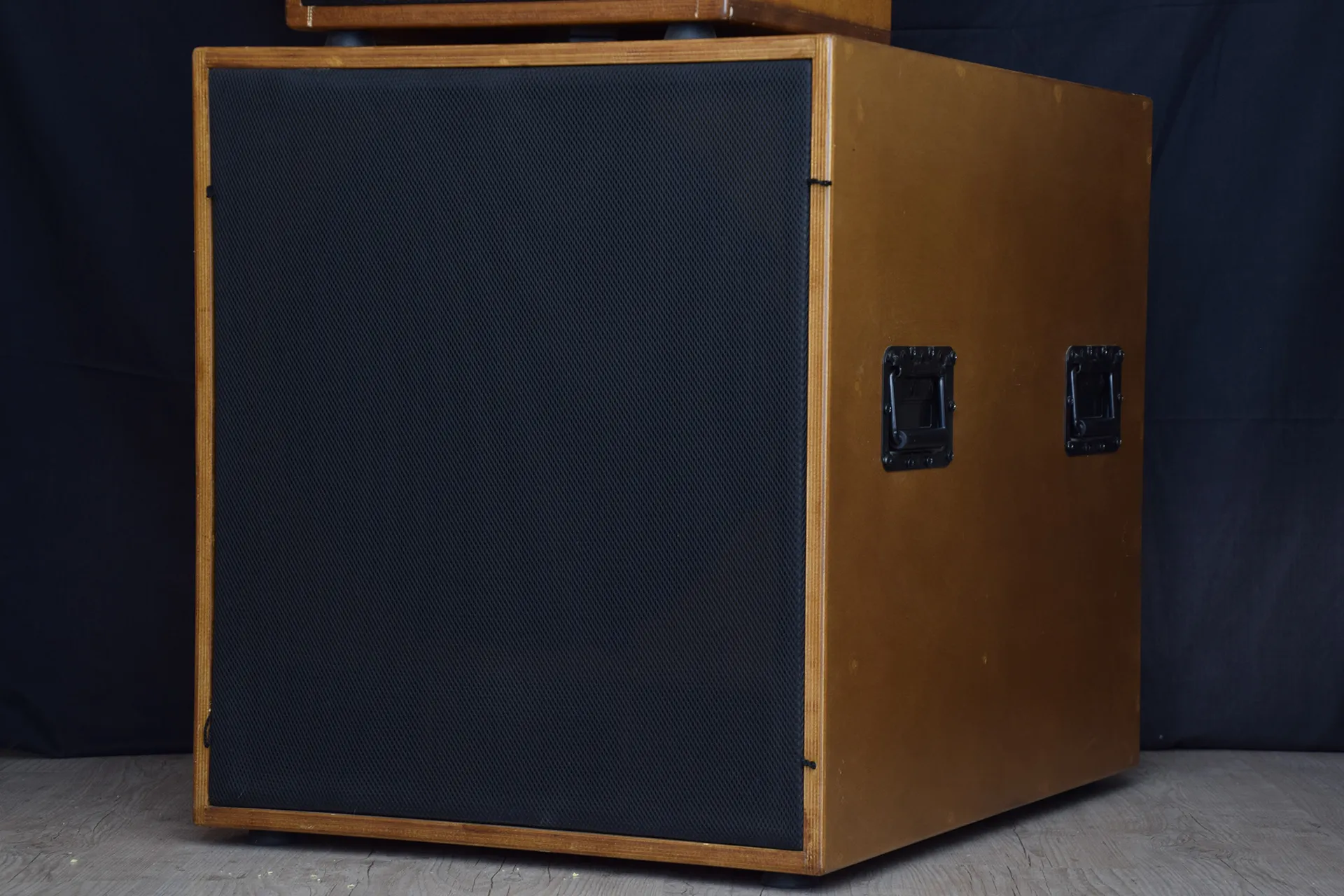 A subwoofer with its grille on